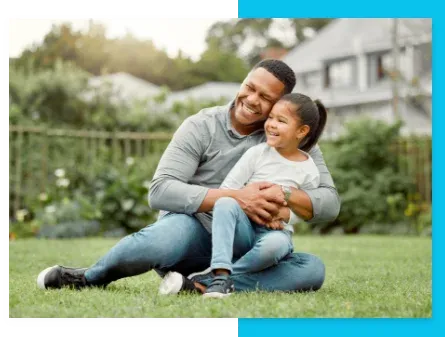 father and daughter outside playing in the backyard